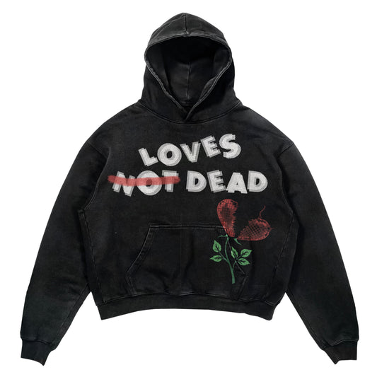Black Acid Wash Hoodie With loves not dead written across the chest.